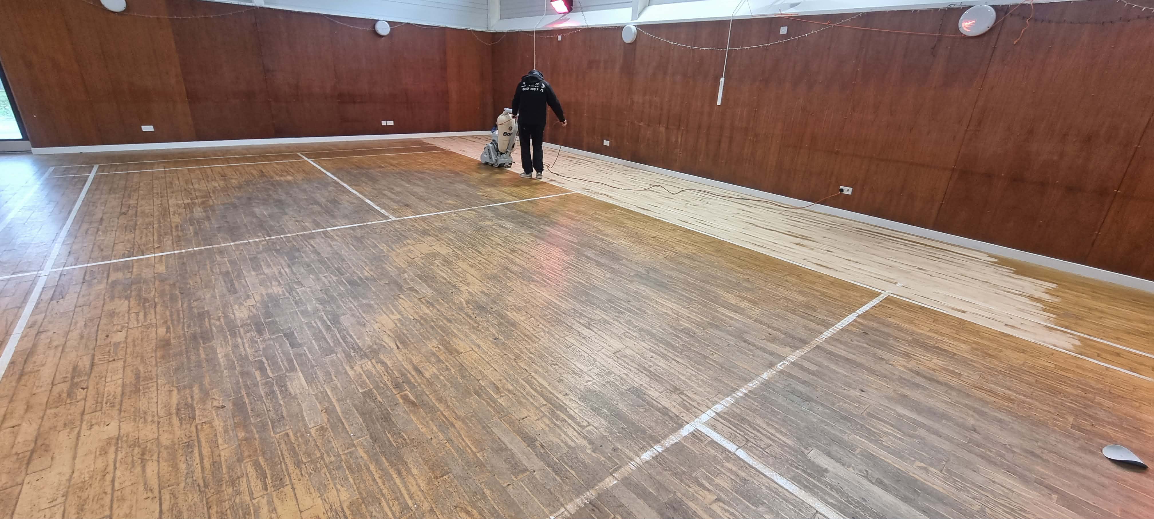 Sports floor coating application